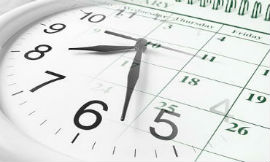 Photo représentant une horloge et un calendrier